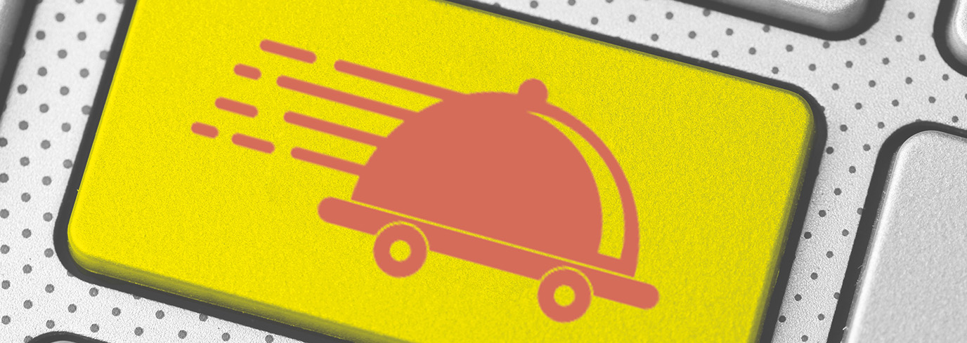 Bouton de clavier jaune avec icône de plateau de repas roulant, symbolisant la livraison rapide